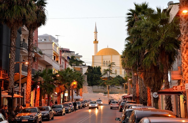 Street in Durres with palms and islamic church