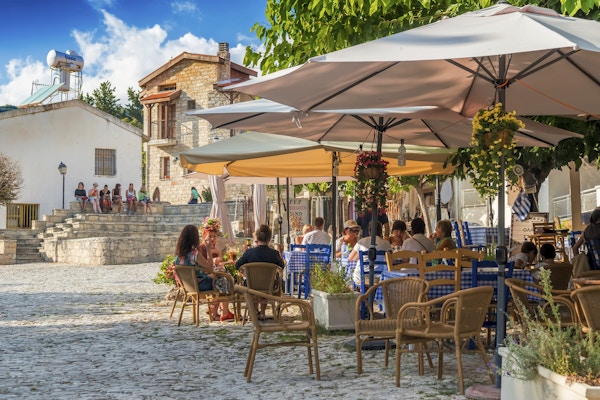 Omodos, Cyprus - October 4, 2015: Street cafe's with tourists in Omodos village, Limassol District.